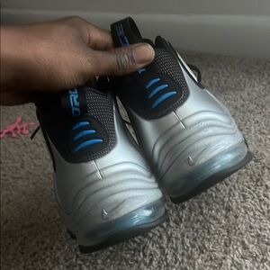 Silver and Black Athletic Shoes with Blue Accent